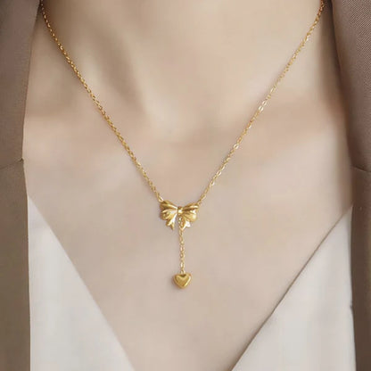 Gold Plated Stainless Steel Anti Tarnish Heart Themed Bow inspired Pendant Necklace