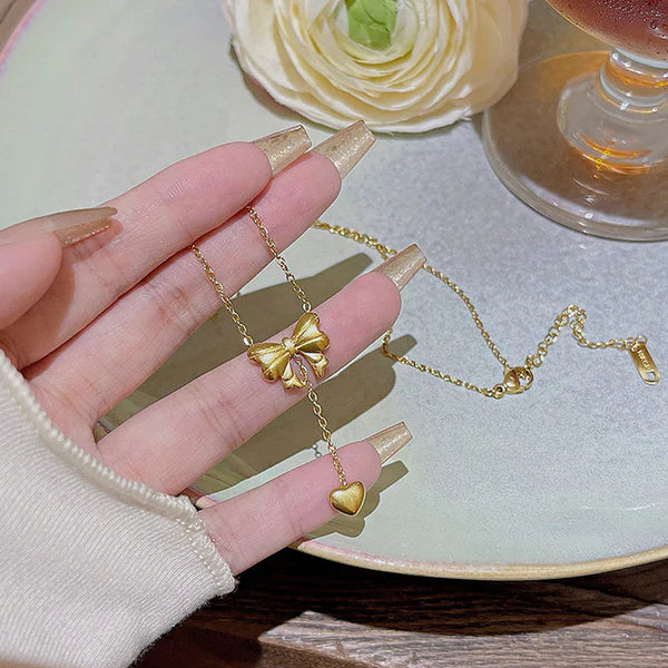 Gold Plated Stainless Steel Anti Tarnish Heart Themed Bow inspired Pendant Necklace