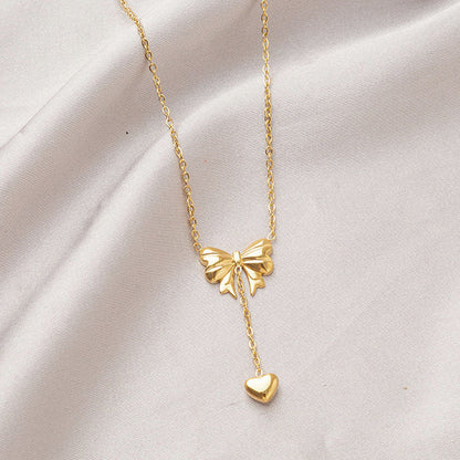 Gold Plated Stainless Steel Anti Tarnish Heart Themed Bow inspired Pendant Necklace
