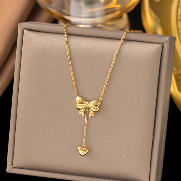 Gold Plated Stainless Steel Anti Tarnish Heart Themed Bow inspired Pendant Necklace - Aurvi