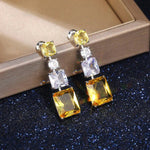 Silver Plated American Diamond Studded Yellow Geometrical Crushed Ice Cut Drop Earrings - Aurvi