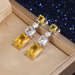 Silver Plated American Diamond Studded Yellow Geometrical Crushed Ice Cut Drop Earrings - Aurvi